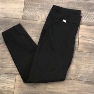 Dark gray colored tummy-control trouser pants.